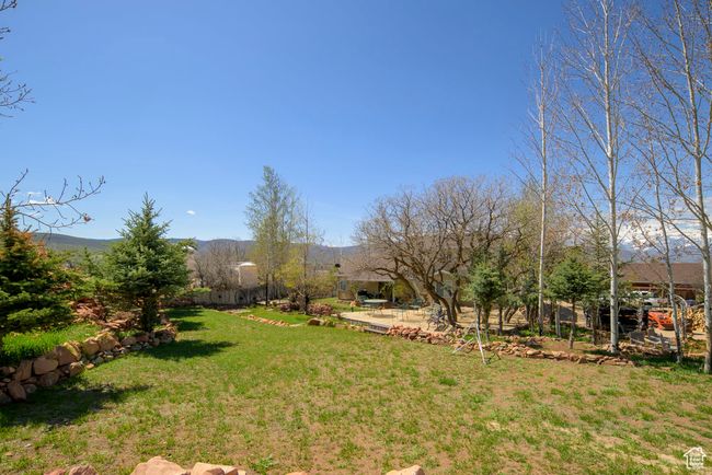 View of yard featuring a mountain view | Image 73