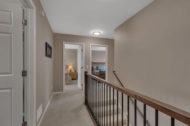 Upper level hall and beautiful iron banister | Image 27