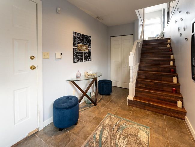Stairs featuring baseboards and visible vents | Image 5