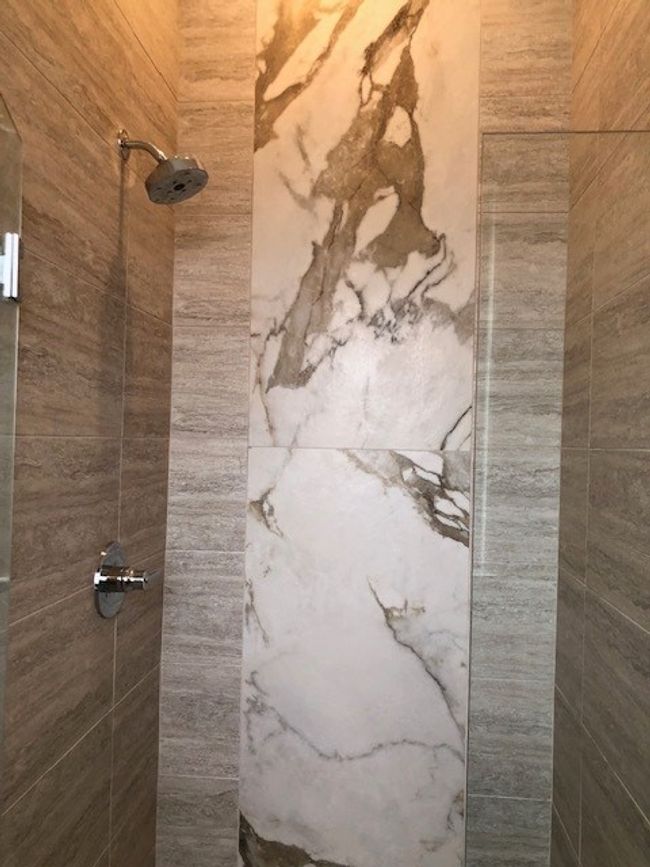 Primary Bathroom featuring tiled shower | Image 25