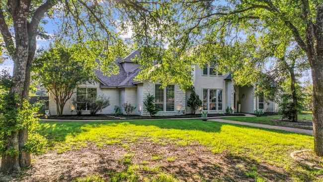Traditional-style home featuring a front lawn and brick siding | Image 35