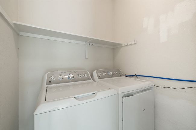 Clothes washing area with separate washer and dryer and laundry area | Image 30