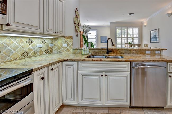 Beautiful cabinetry and overlook to dining area | Image 12