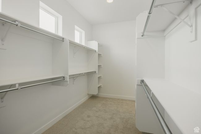 Spacious closet with light colored carpet | Image 33
