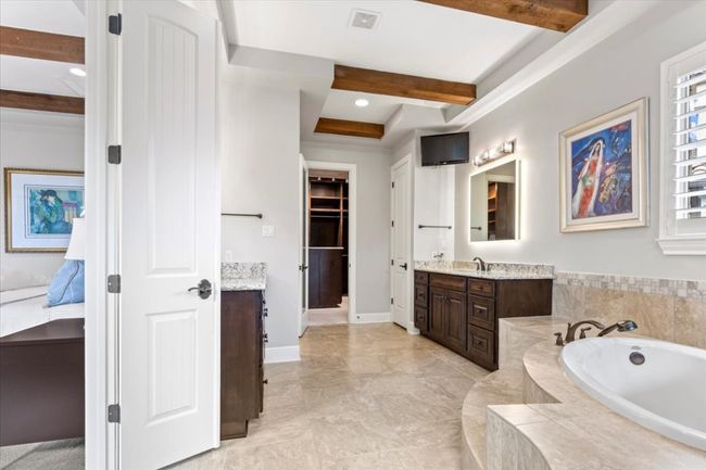 Ensuite bathroom featuring ensuite bath, visible vents, beamed ceiling, a garden tub, and vanity | Image 18