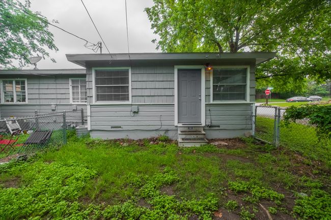 Back of house with entry steps, fence, and crawl space | Image 13
