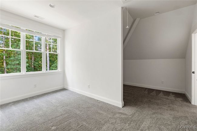 Bonus room with carpet flooring and attic access | Image 26