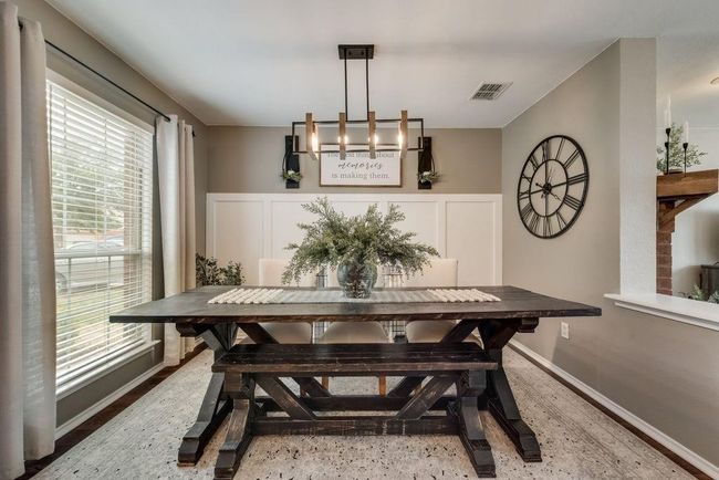 Dining space featuring plenty of natural light, a chandelier, and breakfast area | Image 8