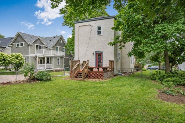 Spacious back yard with main level deck | Image 14