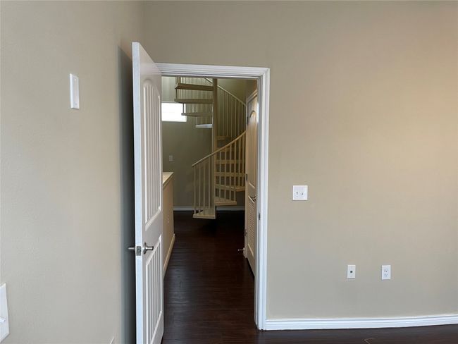 Hall with wood finished floors and baseboards | Image 19