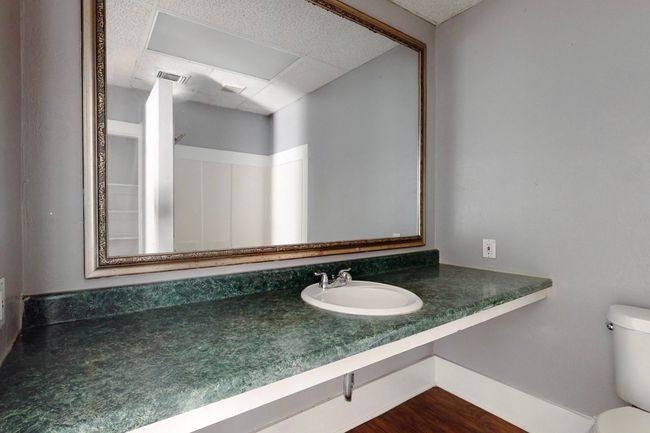 Bathroom with toilet, sink, and hardwood / wood-style floors | Image 20