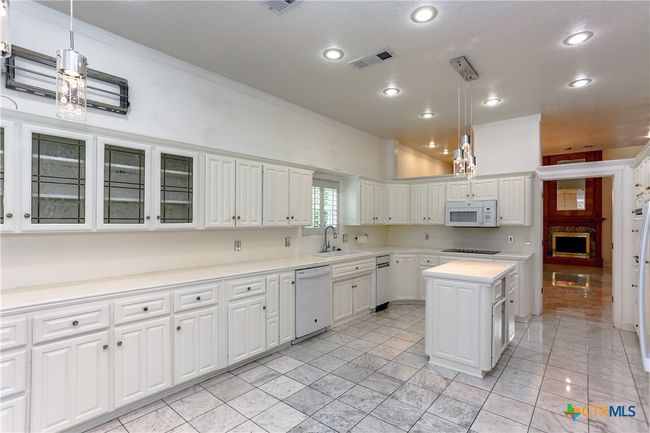 Marble floors throughout the kitchen with loads of countertop space | Image 15