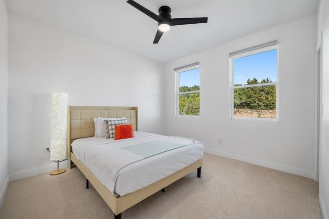 The secondary bedrooms are thoughtfully designed with a Jack-and-Jill bathroom, offering convenience, privacy, and stylish functionality. | Image 26