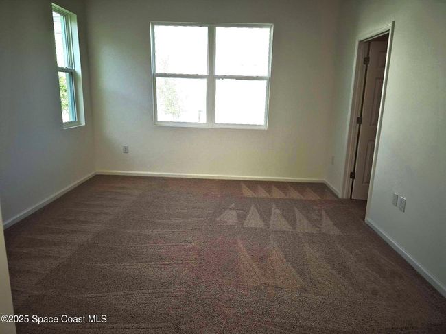 view from bathroom to primary bedroom | Image 15