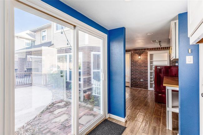 Access out to the backyard and pool can be found in the enclosed walkway. | Image 35