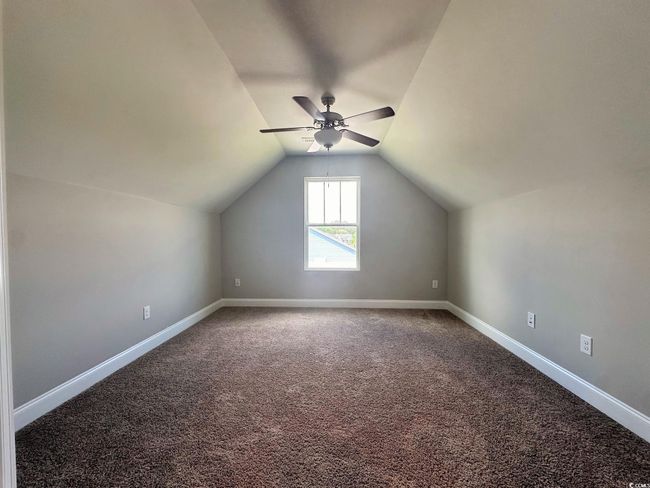 Spacious closet with visible vents, attic access, and dark wood finished floors | Image 15