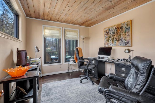 Home office with crown molding, dark wood-type flooring, and wooden ceiling | Image 15