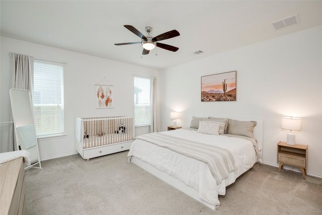 Carpeted bedroom with baseboards and a ceiling fan | Image 12