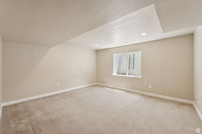 Bonus room featuring light colored carpet, recessed lighting, and a textured ceiling | Image 36