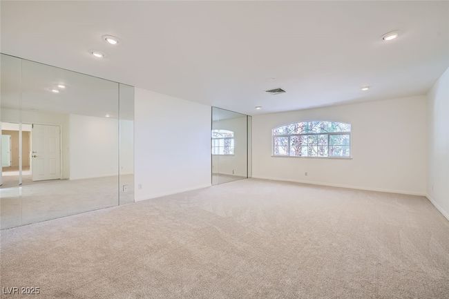 Unfurnished bedroom with recessed lighting, visible vents, baseboards, and light colored carpet | Image 36