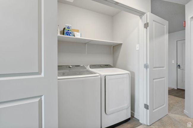 Laundry room with baseboards, separate washer and dryer, and laundry area | Image 20
