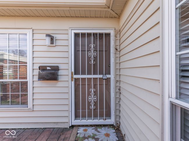 A storm door allows extra light to shine in if desired | Image 6