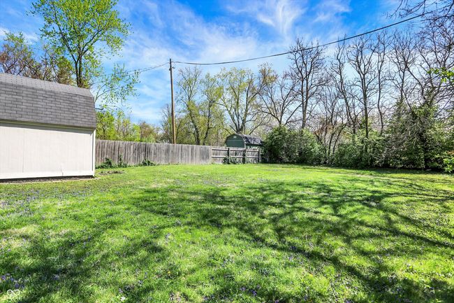 view of yard featuring fence and an outbuilding | Image 43