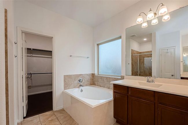 Primary ensuite with garden soaker tub and double vanities | Image 19