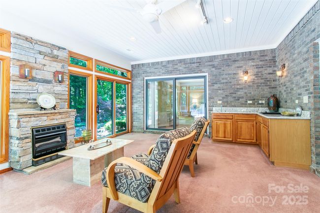 You will enjoy this room with the mini bar in the corner. Great for entertaining or just a quiet night in by the fire. | Image 15