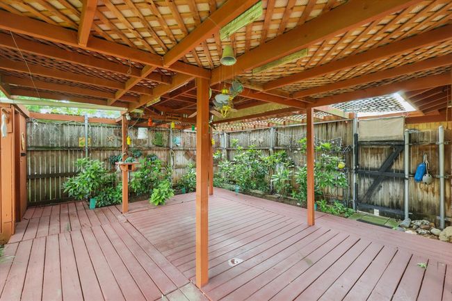 Deck featuring a fenced backyard | Image 36