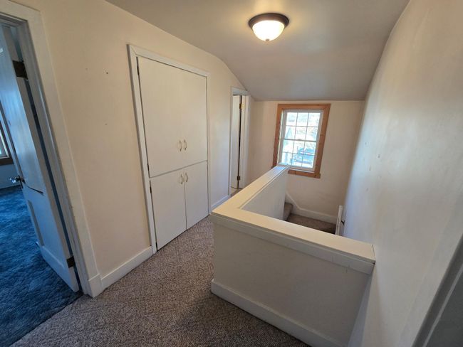 Upper level hallway to 2 more bedrooms and bath | Image 22