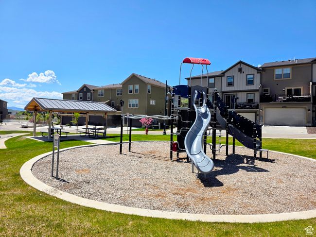 Community play area featuring a residential view, a lawn, and a gazebo | Image 44
