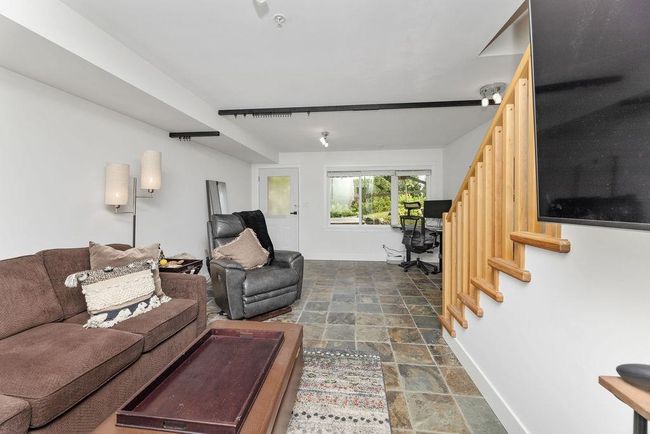 Downstairs recreation area/family room that could be converted to a third bedroom or used as a home business with separate entry | Image 31