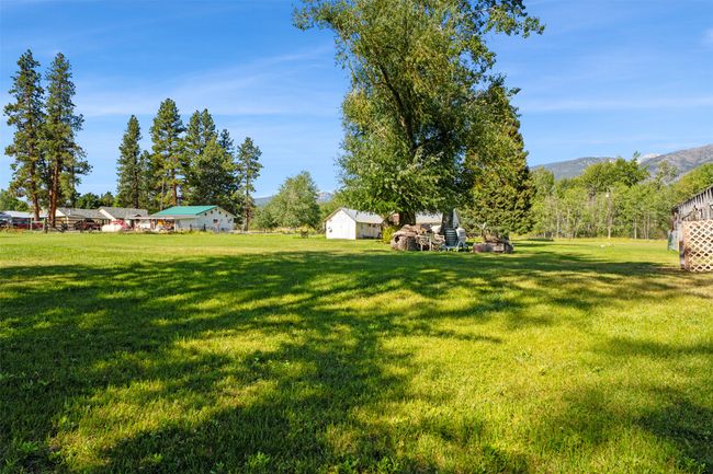 View of grassy yard with a mountain view | Image 16