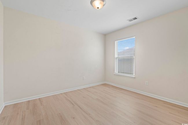 Empty room with baseboards and light wood-style flooring | Image 16