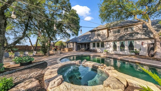 View of pool featuring a pool with connected hot tub and a patio area | Image 31