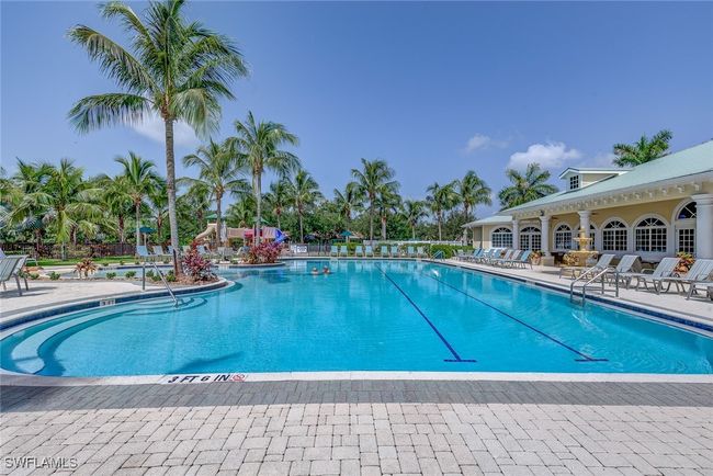 Community pool with fence and a patio area | Image 39