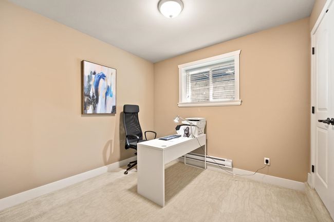 Office featuring a baseboard heating unit and carpet | Image 27