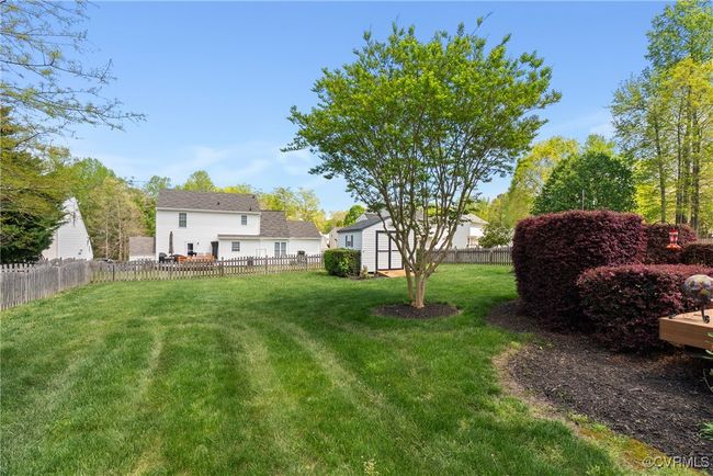 There is enough room in the fenced backyard for your fur family to run around! | Image 43