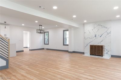 Living room with light hardwood / wood-style floors | Image 3