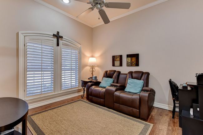 Living room featuring wood finished floors, ceiling fan, baseboards, ornamental molding, and recessed lighting | Image 24