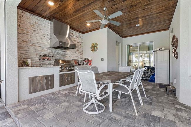 Dining space with recessed lighting, wood ceiling, ceiling fan, and crown molding | Image 24