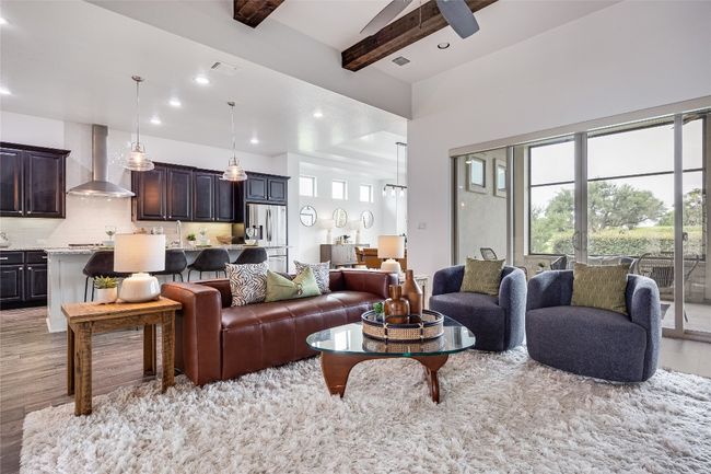 Living room featuring light wood-type flooring, beamed ceiling, recessed lighting, and a ceiling fan | Image 6