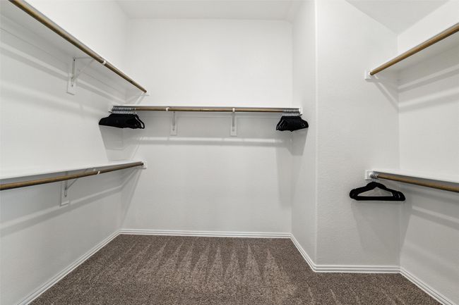 Walk in closet featuring carpet floors | Image 25