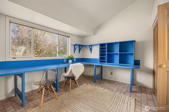 The fourth bedroom was used as a craft room and has two closets along the opposite wall of the built-in desk. | Image 35