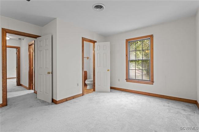 Unfurnished bedroom with carpet flooring and ensuite bath | Image 26