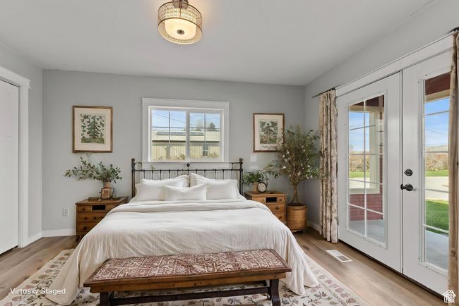 Bedroom with access to exterior, french doors, and light wood-style flooring | Image 10