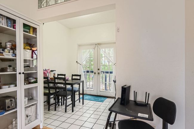 Dining area featuring light tile patterned floors and french doors | Image 9