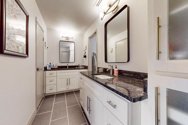Master Bathroom featuring two vanities | Image 20
