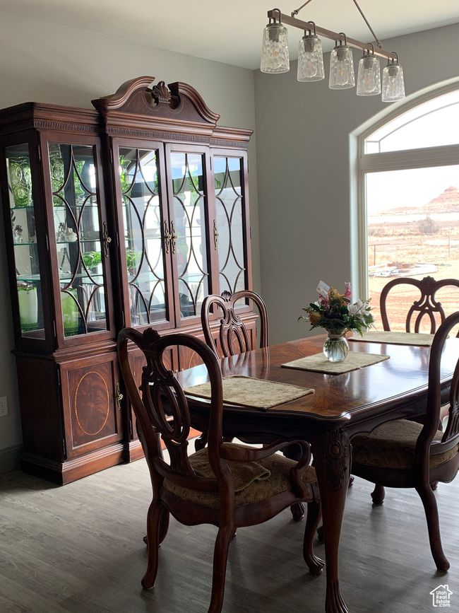 Dining space with plenty of natural light and wood finished floors | Image 5
